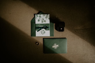 a green and white card with a bow on it