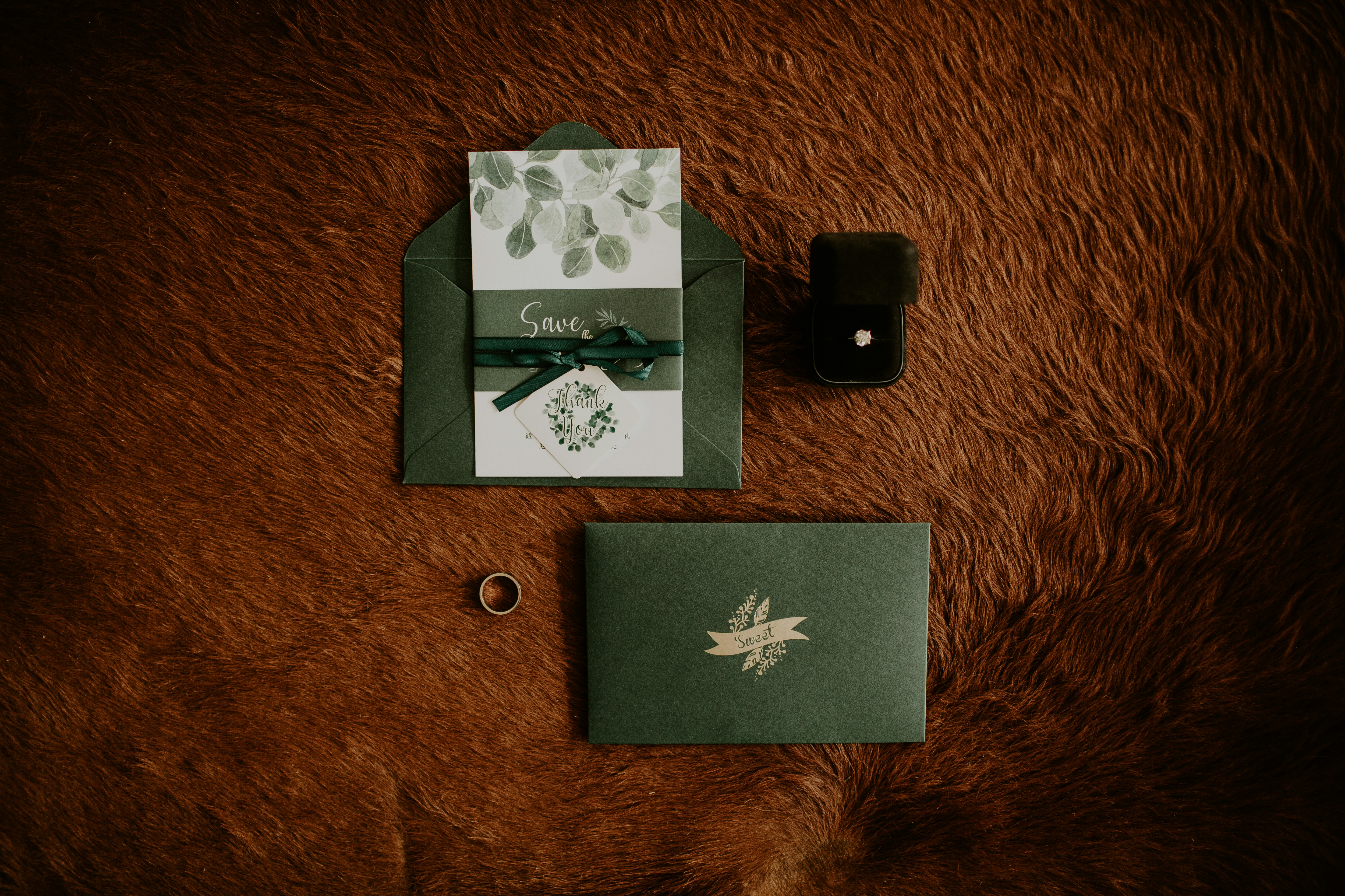 invitations and rings. lay flat photo.