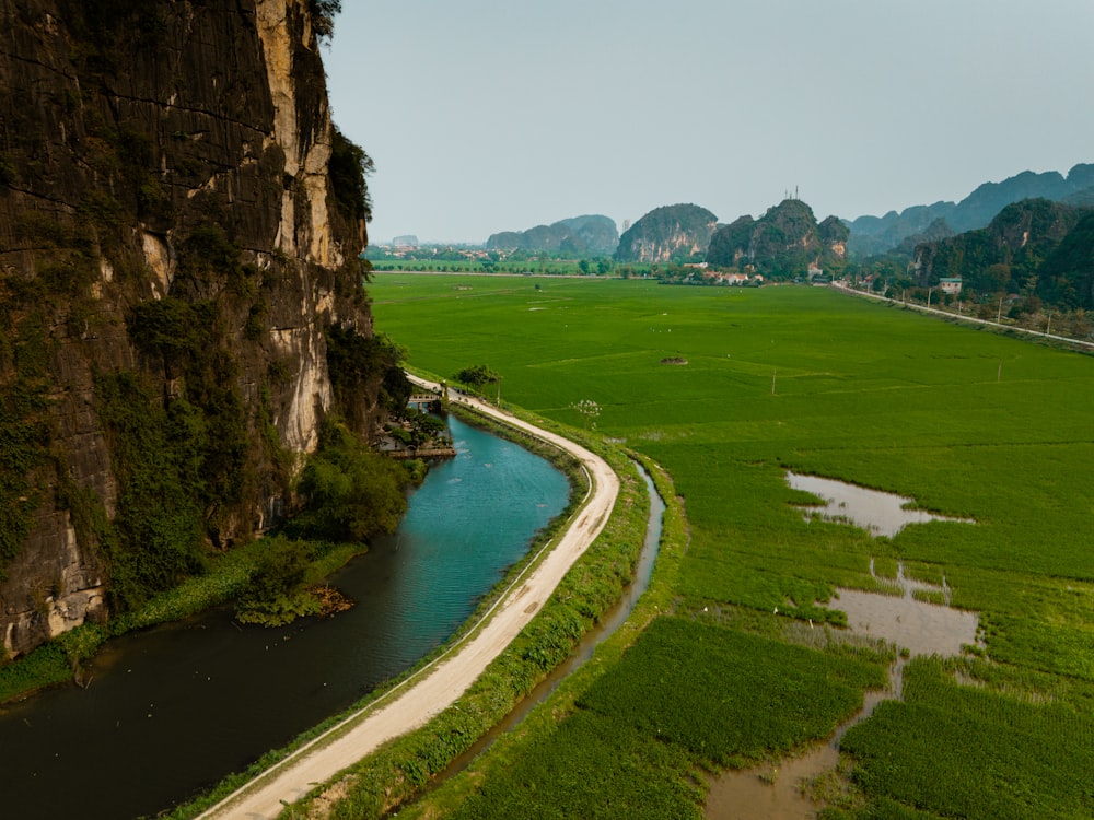 a river running through a lush green valley