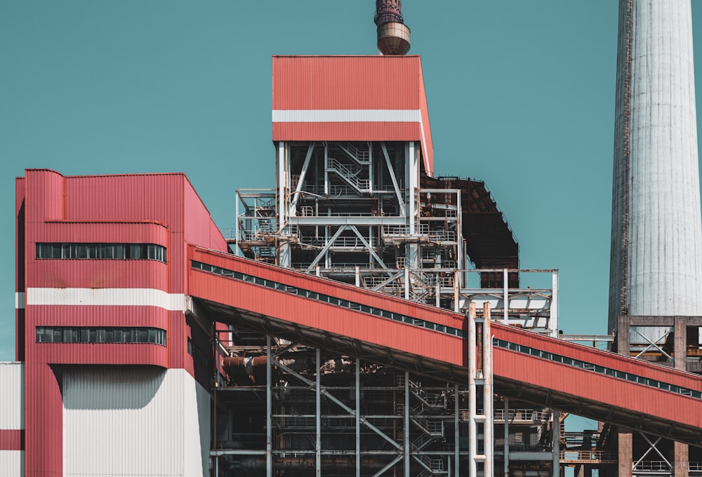 a factory building with a large pipe sticking out of it's side