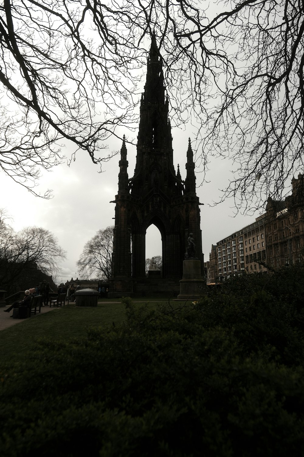 a very tall tower with a clock on it's side