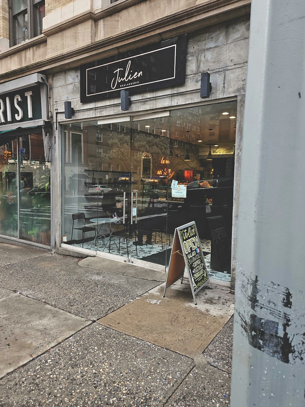 a store front with a sign in front of it