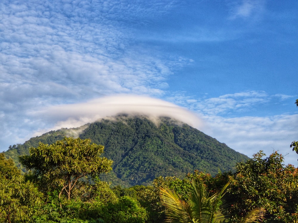 a mountain with a cloud in the sky