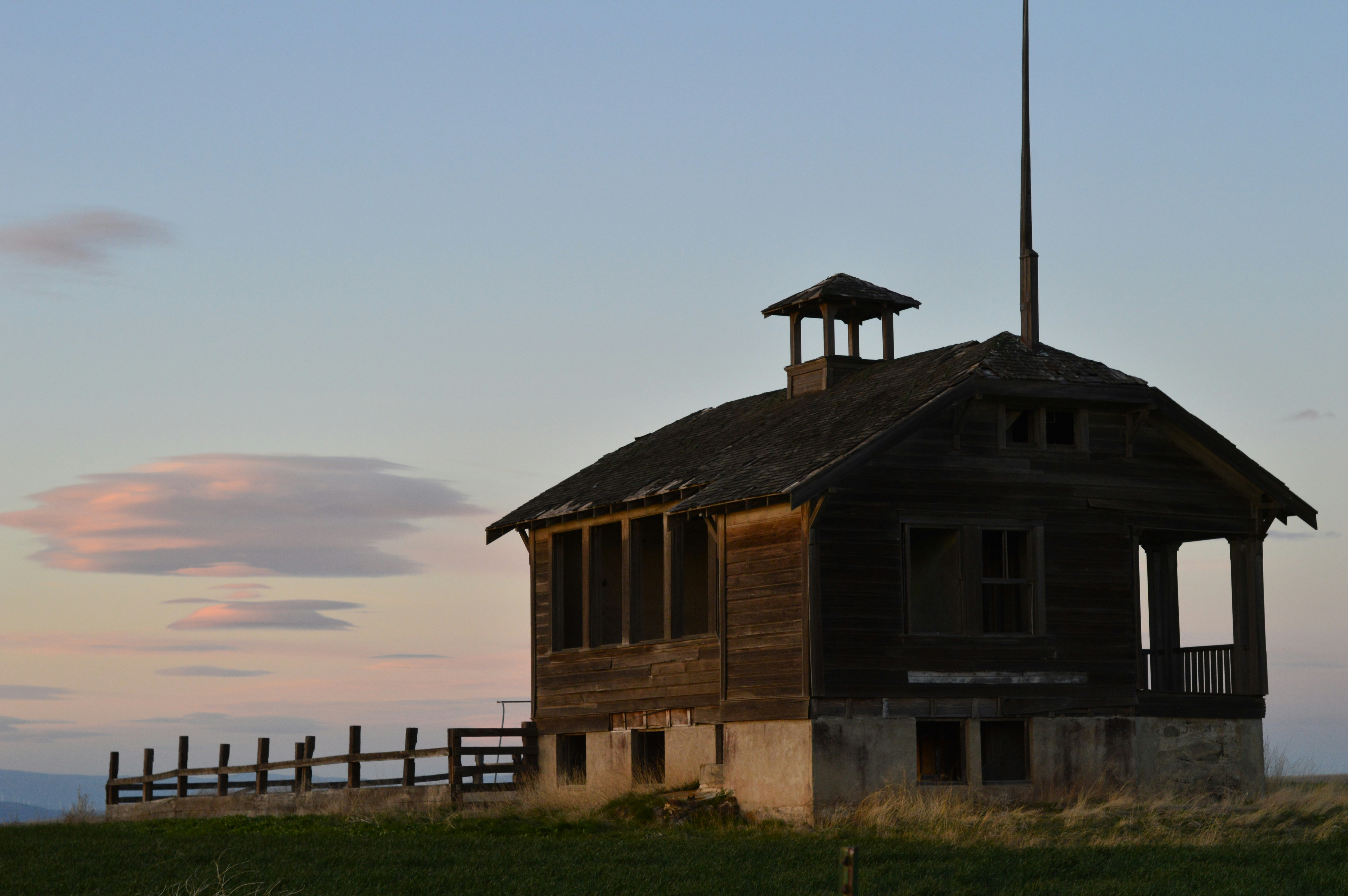 an old building with a flag on top of it