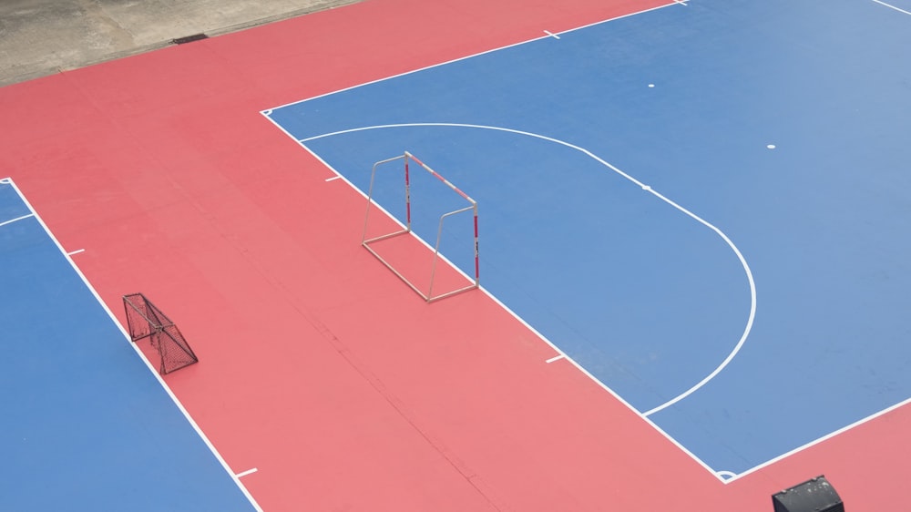 a basketball court with a blue and red court