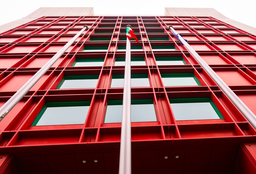 a tall red building with lots of windows