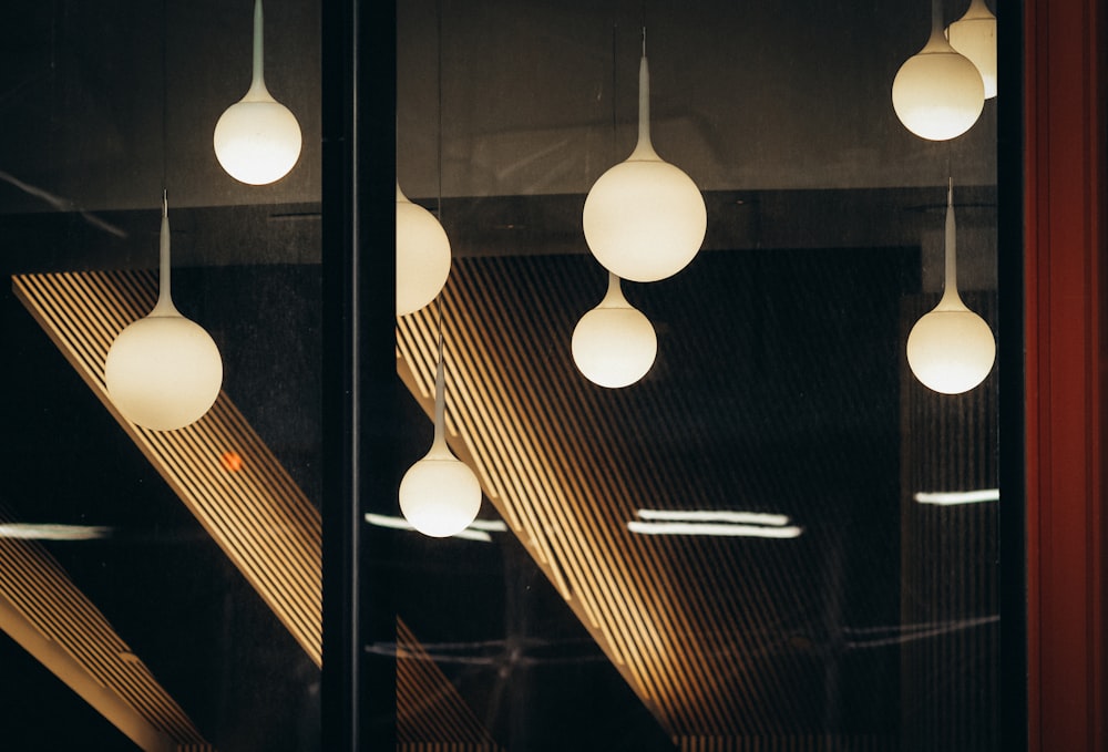 a number of lights hanging from a ceiling