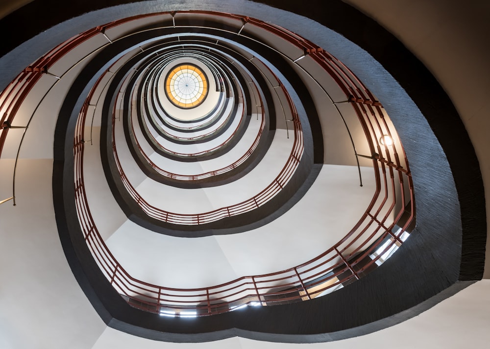 a spiral staircase with a circular window in the center