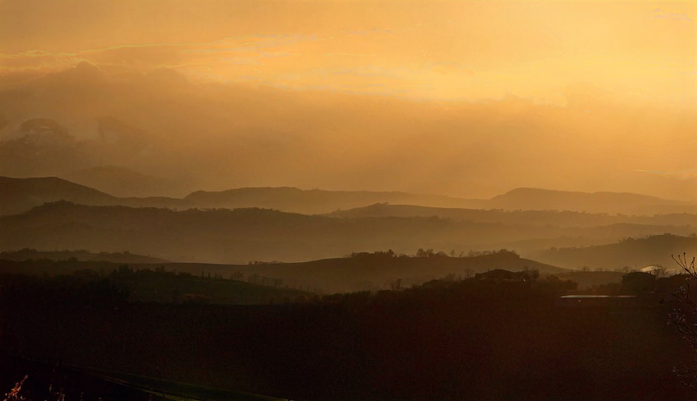 a view of a mountain range at sunset