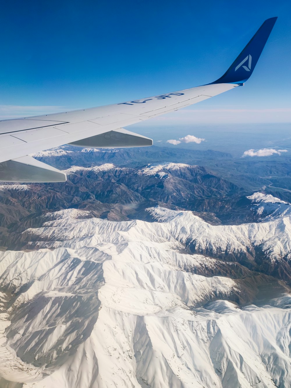 a view of a mountain range from an airplane