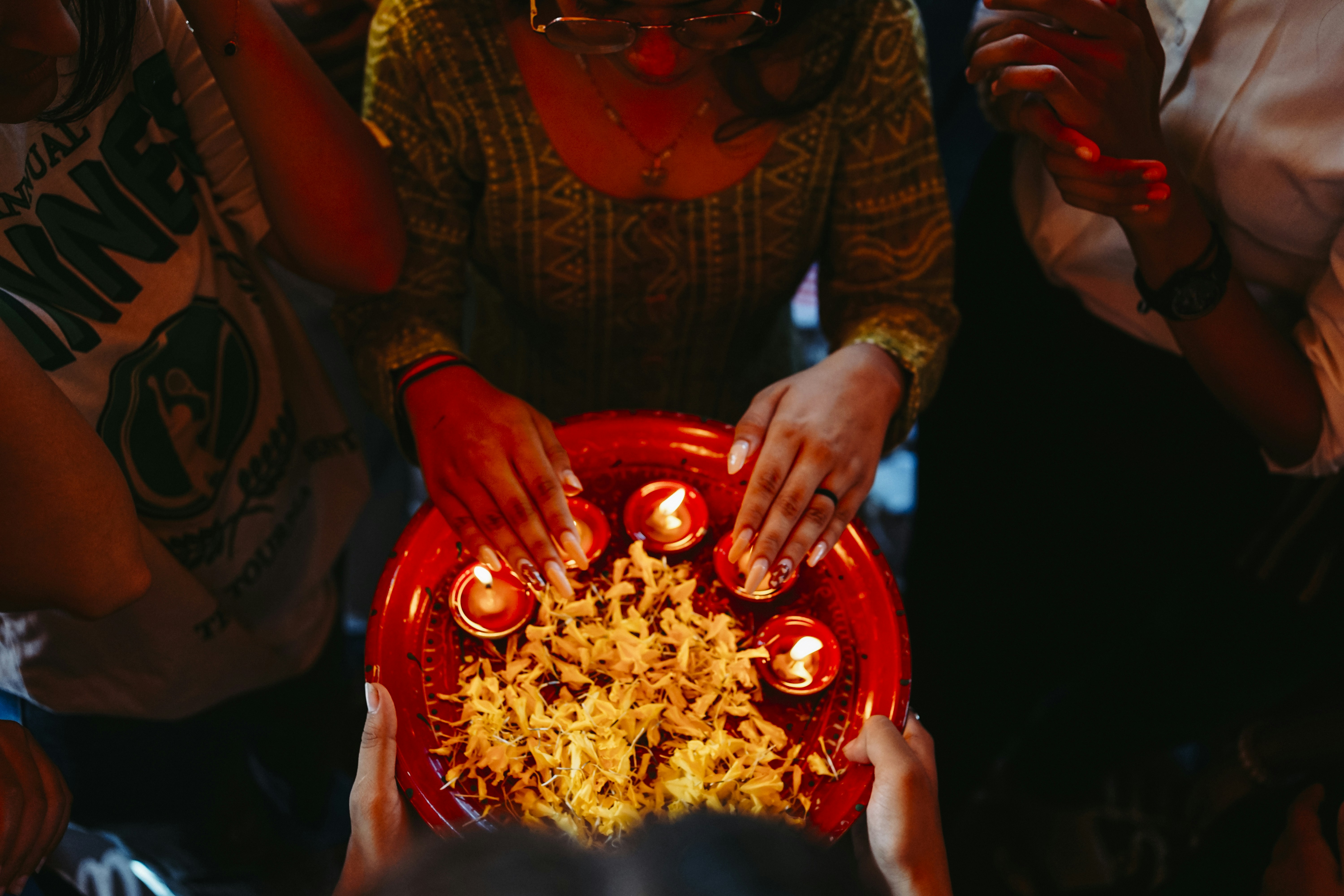 Group sharing a dish at a party table
