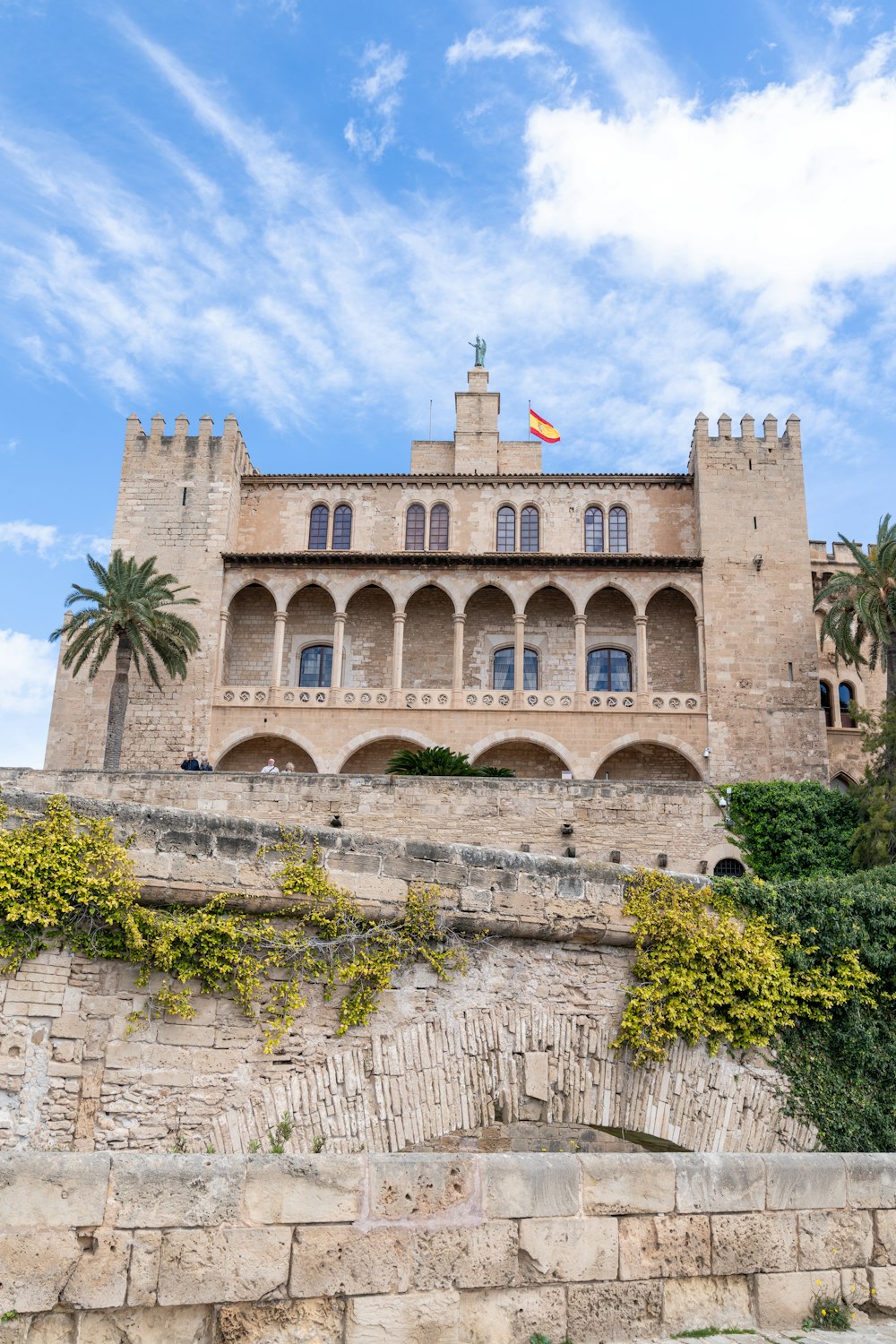 a castle like building with a flag on top of it