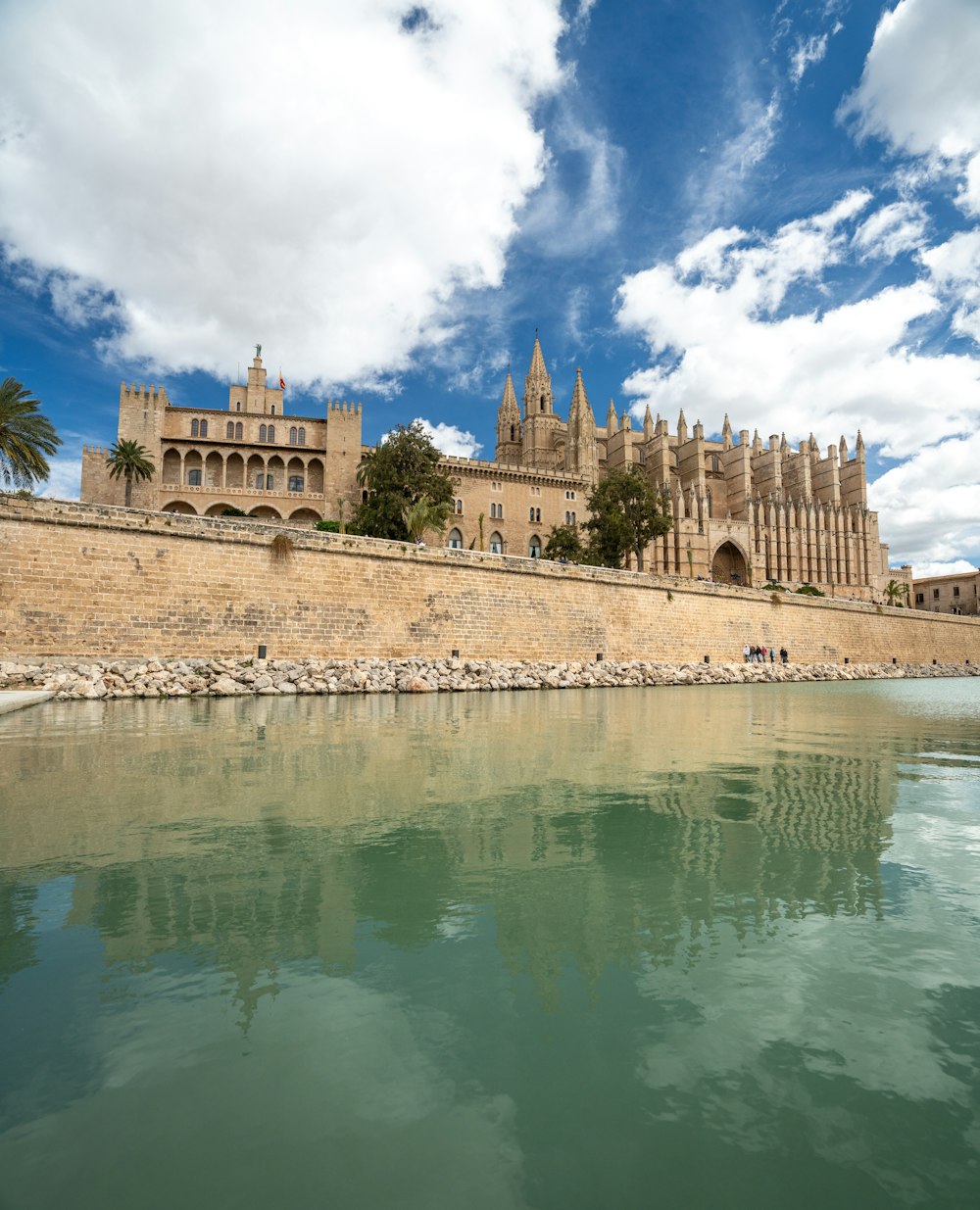 a large building sitting next to a body of water