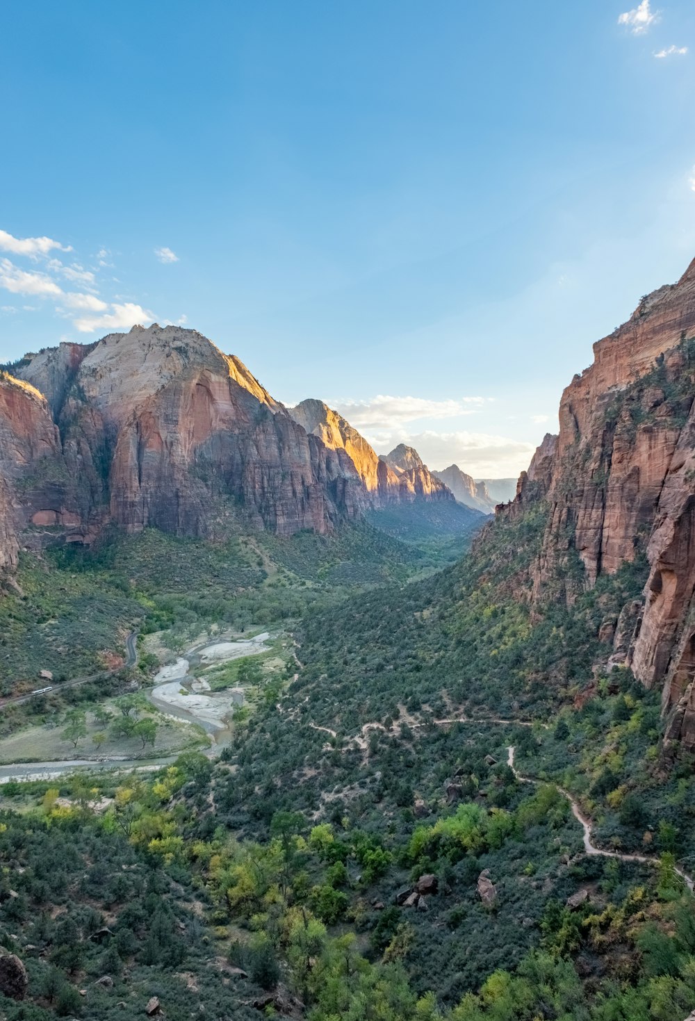 a scenic view of a valley surrounded by mountains