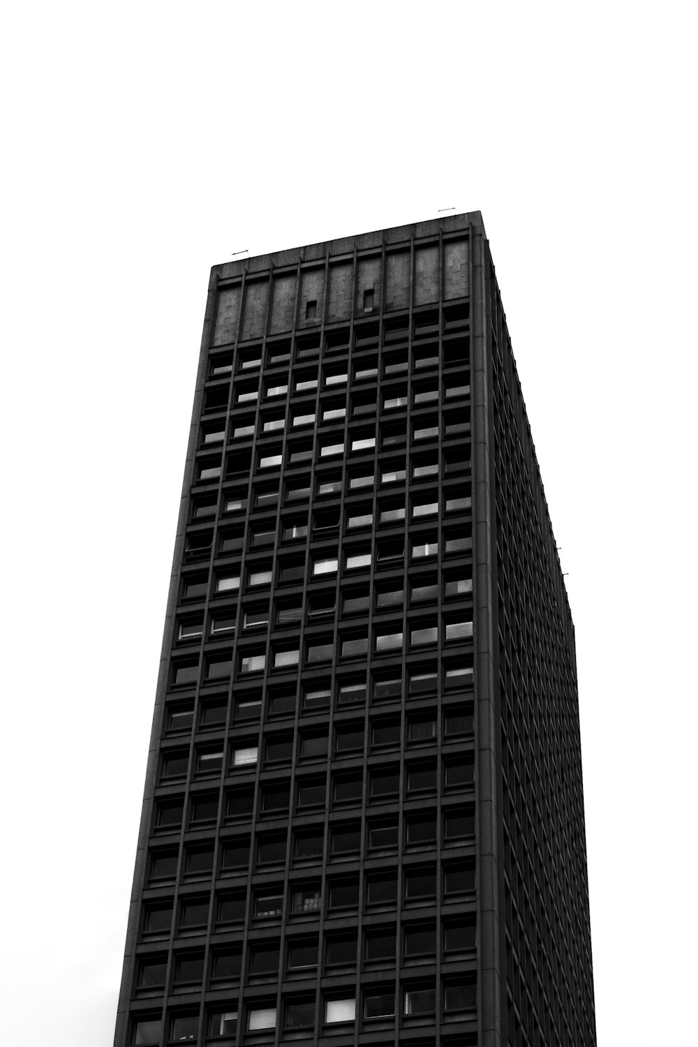 a black and white photo of a tall building