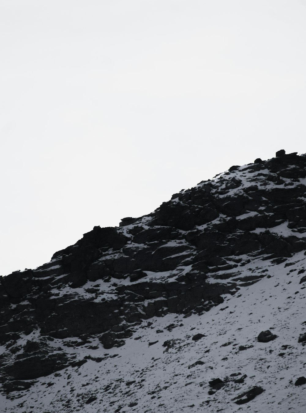 a person on a snowboard going down a hill