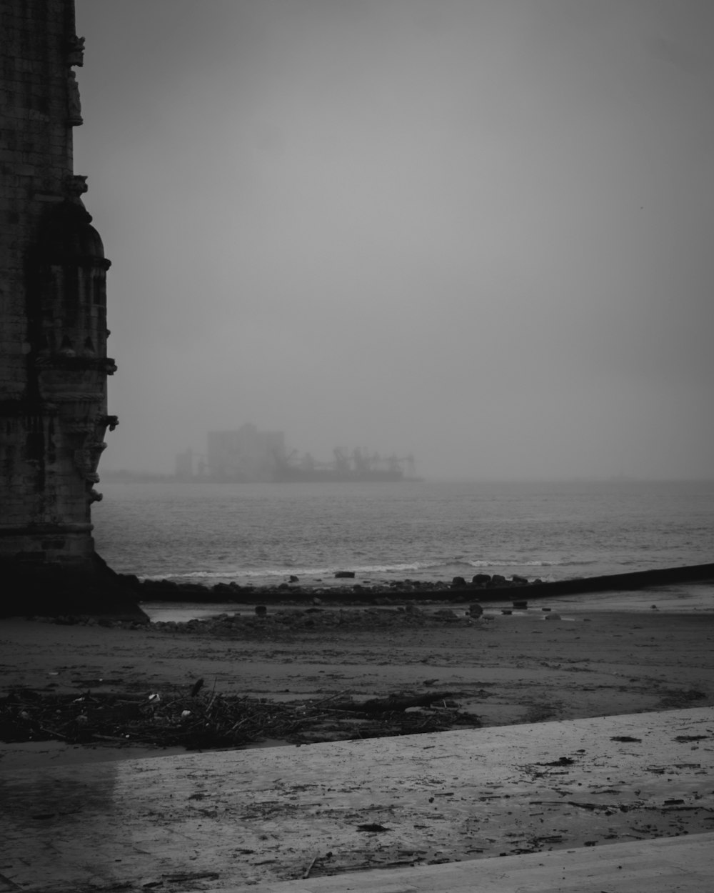 a black and white photo of a ship in the distance