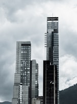 a black and white photo of a city with tall buildings