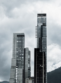 a black and white photo of a city with tall buildings