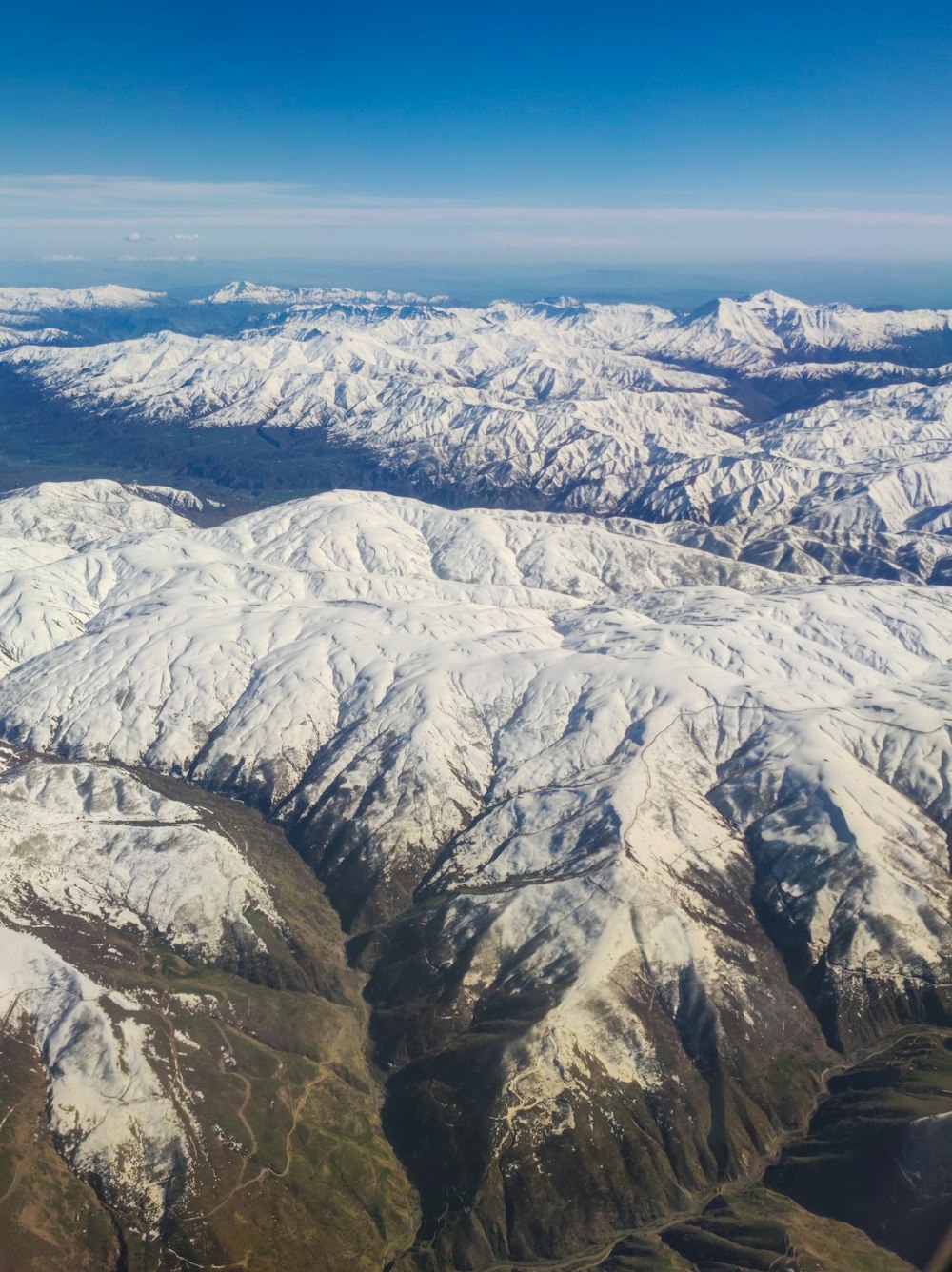 a view of the mountains from an airplane