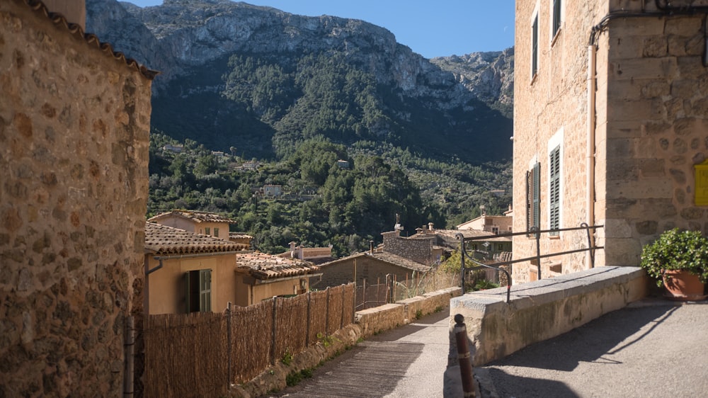 a stone building with a mountain in the background