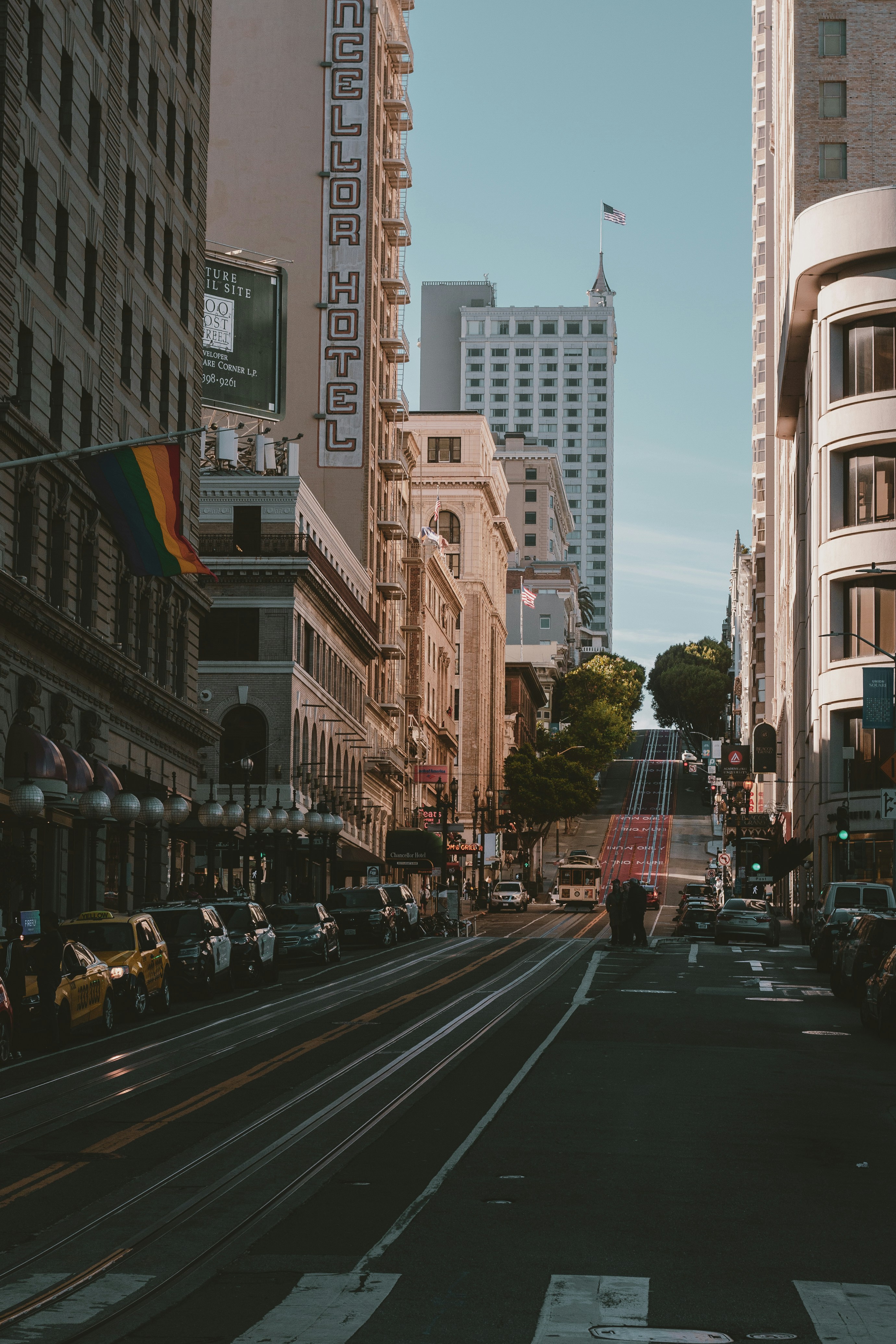 a city street filled with traffic and tall buildings