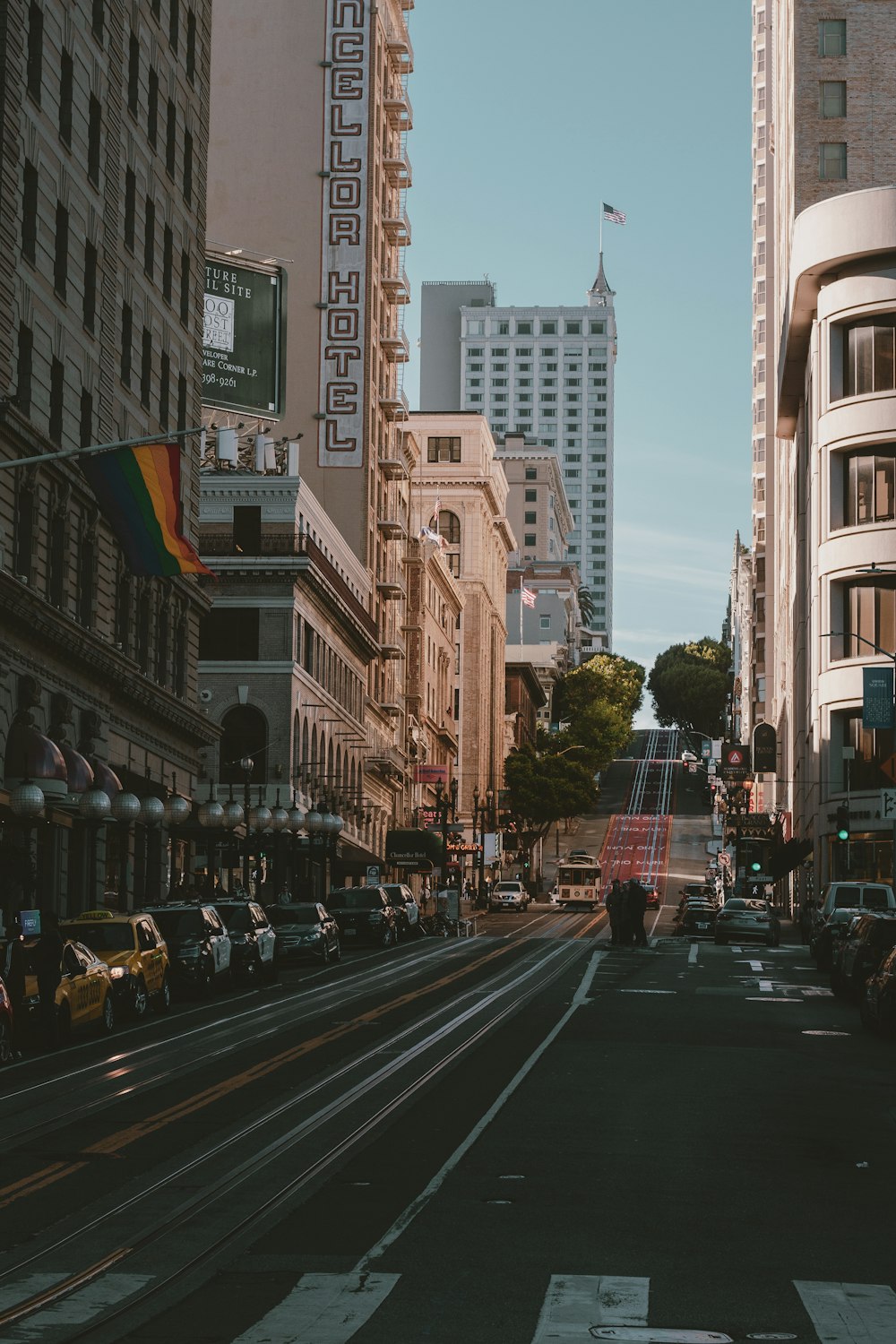 a city street filled with traffic and tall buildings