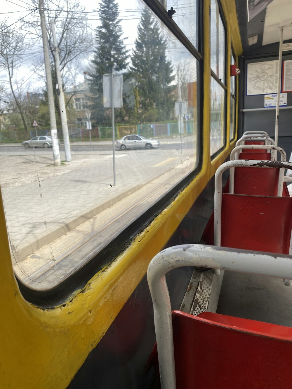 a view of a street from inside a bus