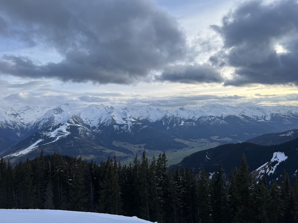 a view of a mountain range covered in snow