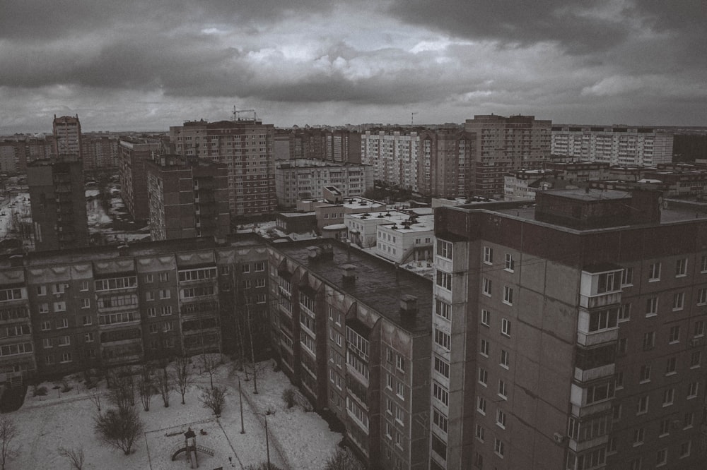 a black and white photo of a city with tall buildings