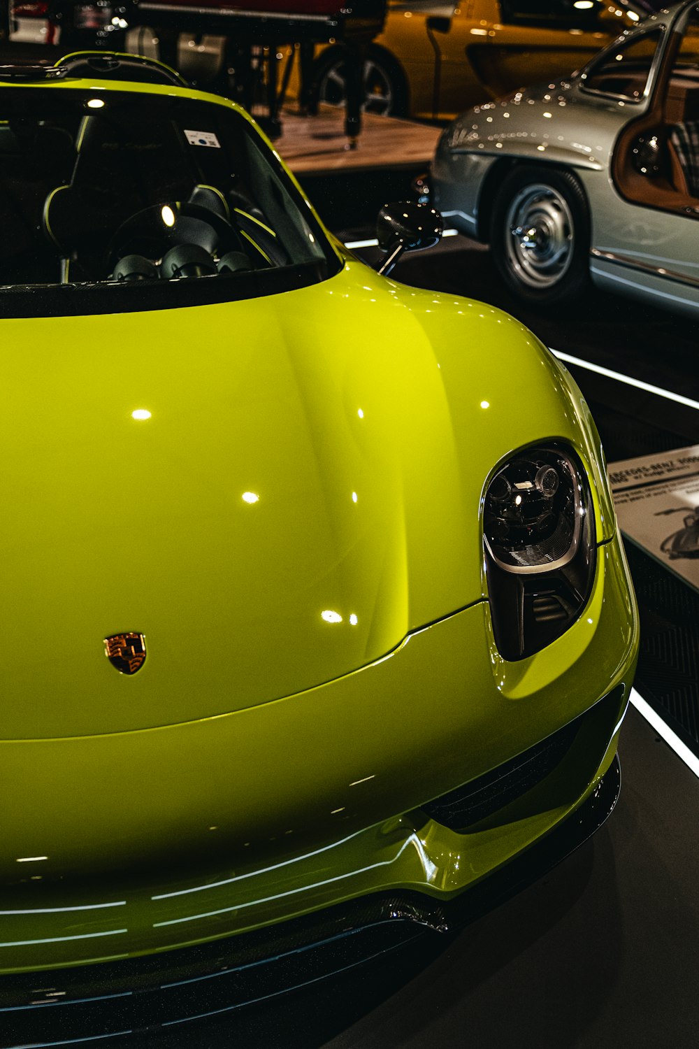 a lime green sports car is on display