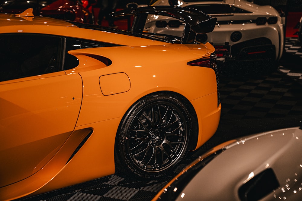 a yellow sports car parked in a garage