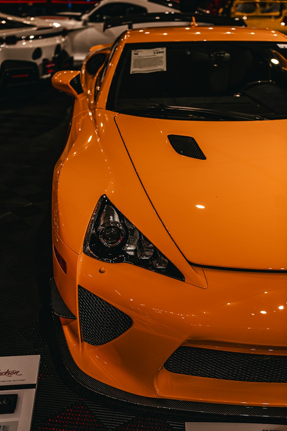 a close up of a sports car on display