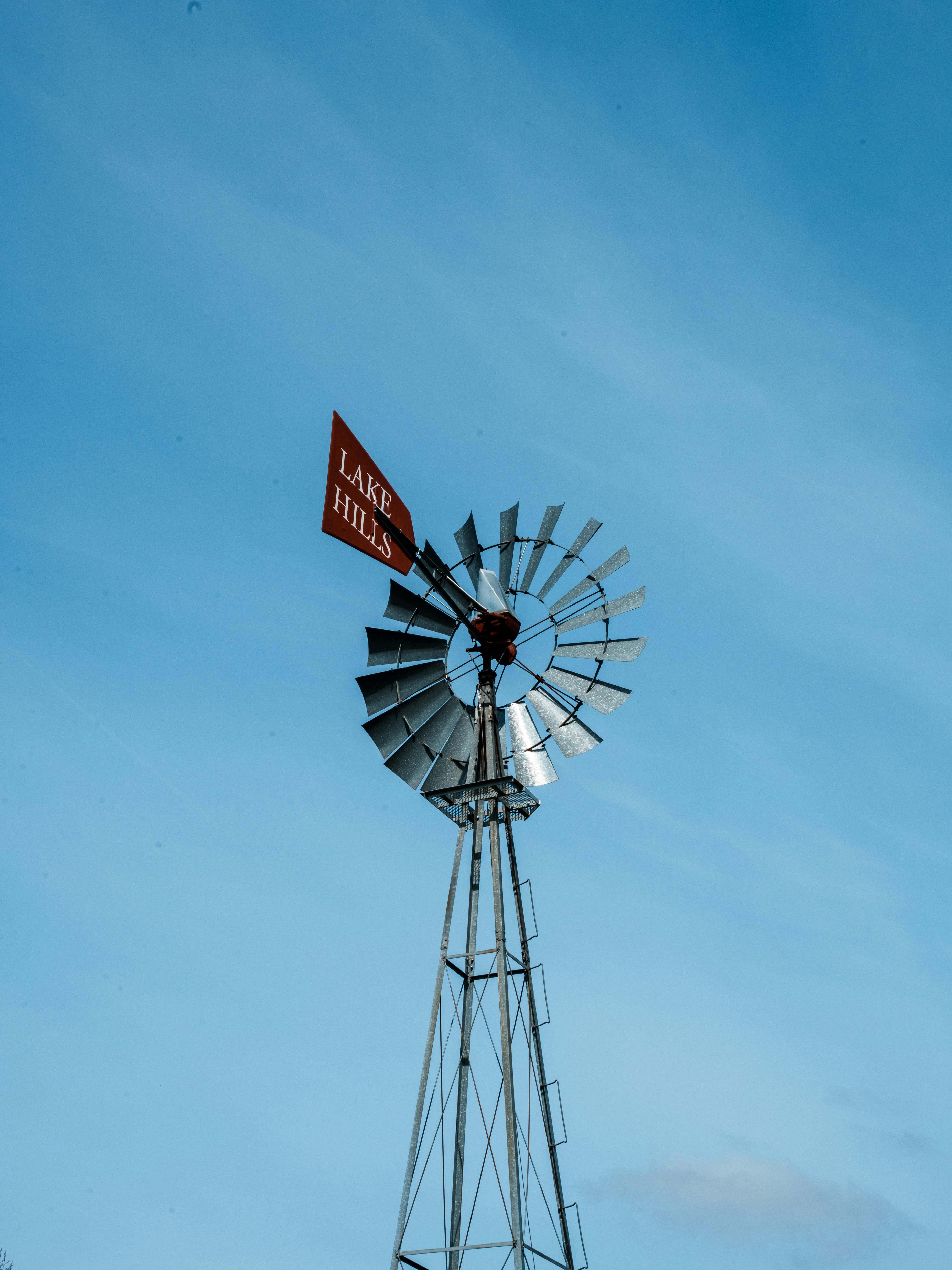 a windmill with a flag on top of it