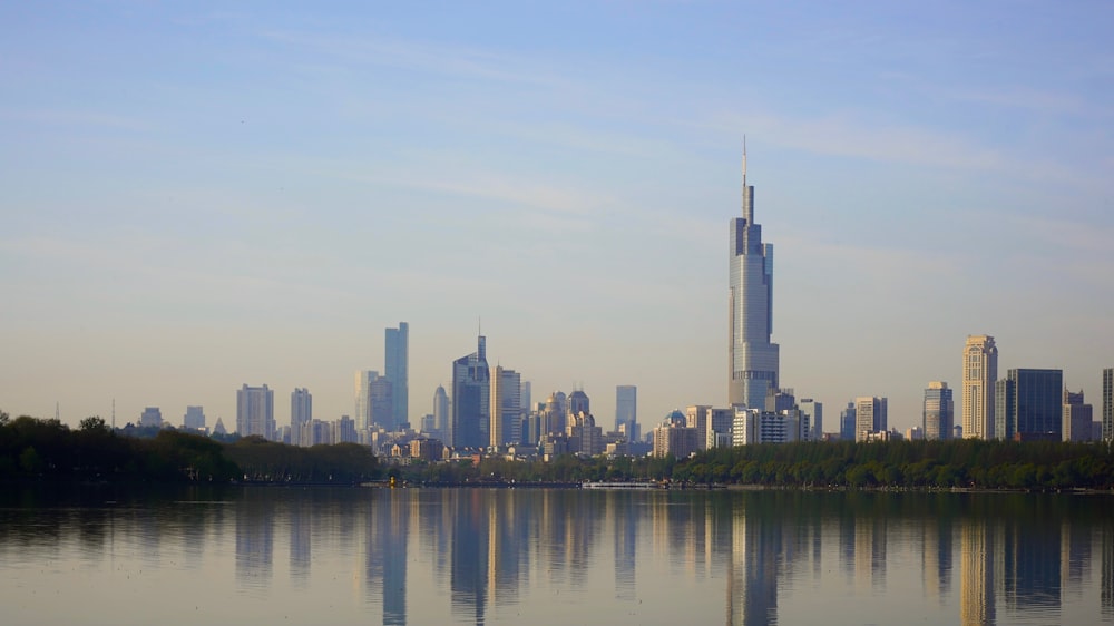 a large body of water with a city in the background