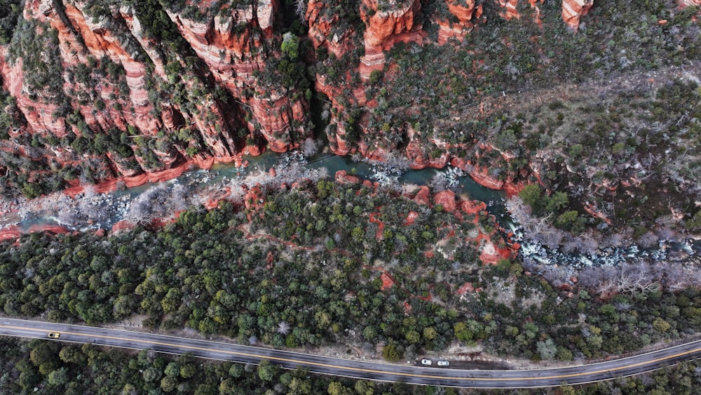 an aerial view of a winding road in the mountains