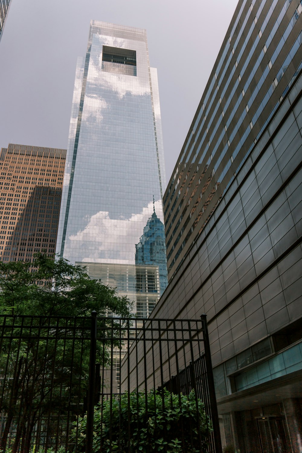 a tall building with a sky scraper in the background