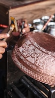 a person is working on a metal object