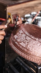a person is working on a metal object