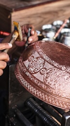 a person is working on a metal object
