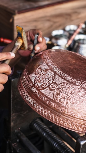 a person is working on a metal object