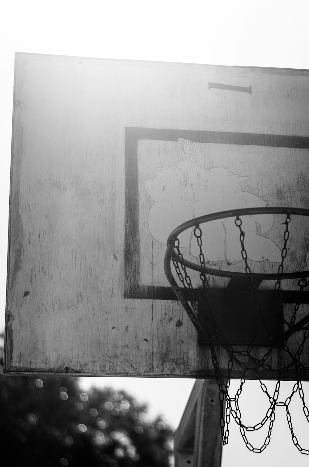 a black and white photo of a basketball hoop