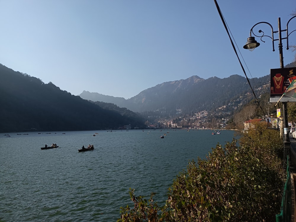 a body of water surrounded by mountains and trees