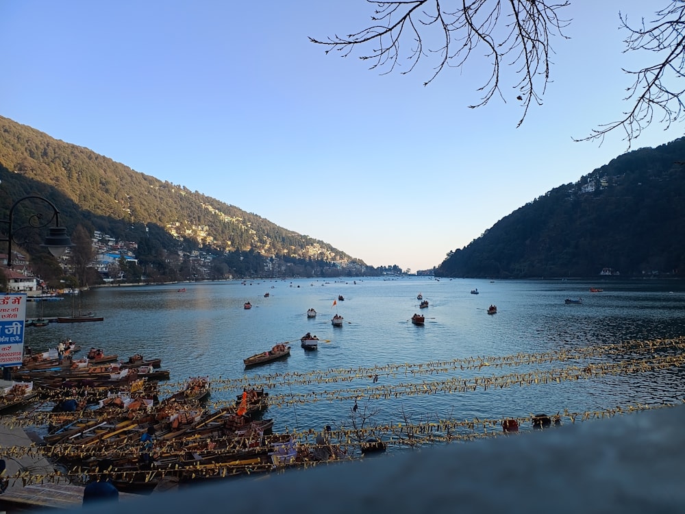 a lake filled with lots of boats floating on top of it