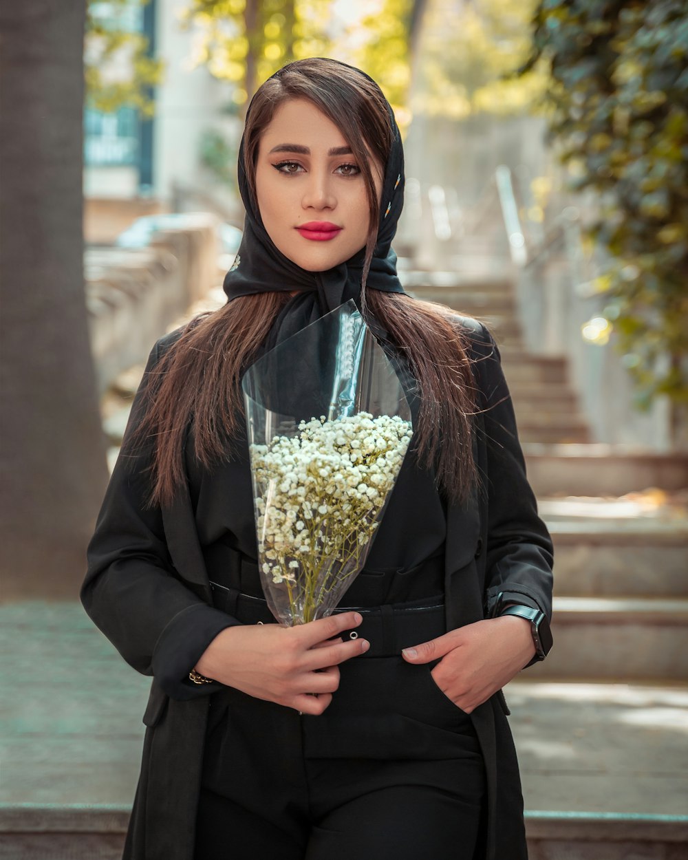 a woman in a nun outfit holding a bouquet of flowers