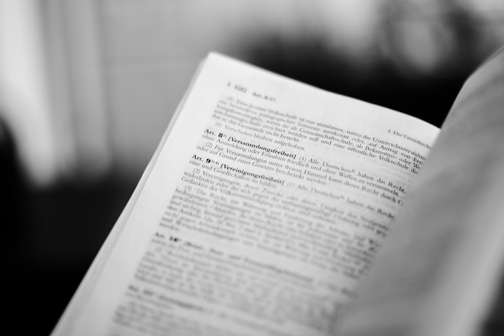 a close up of a person reading a book