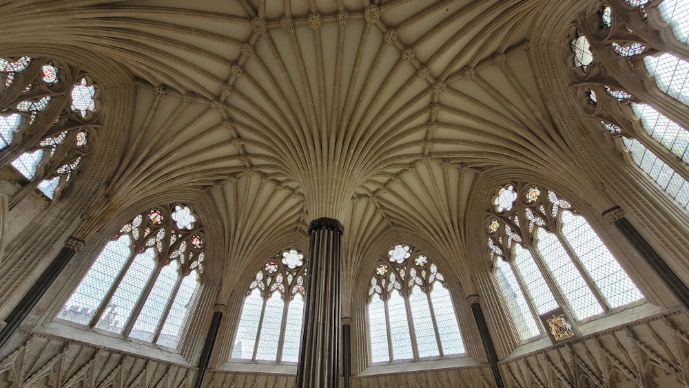 the ceiling of a large cathedral with many windows