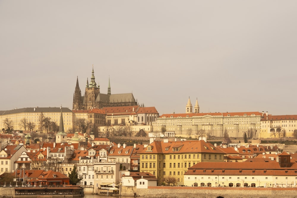 a view of a city with a castle in the background