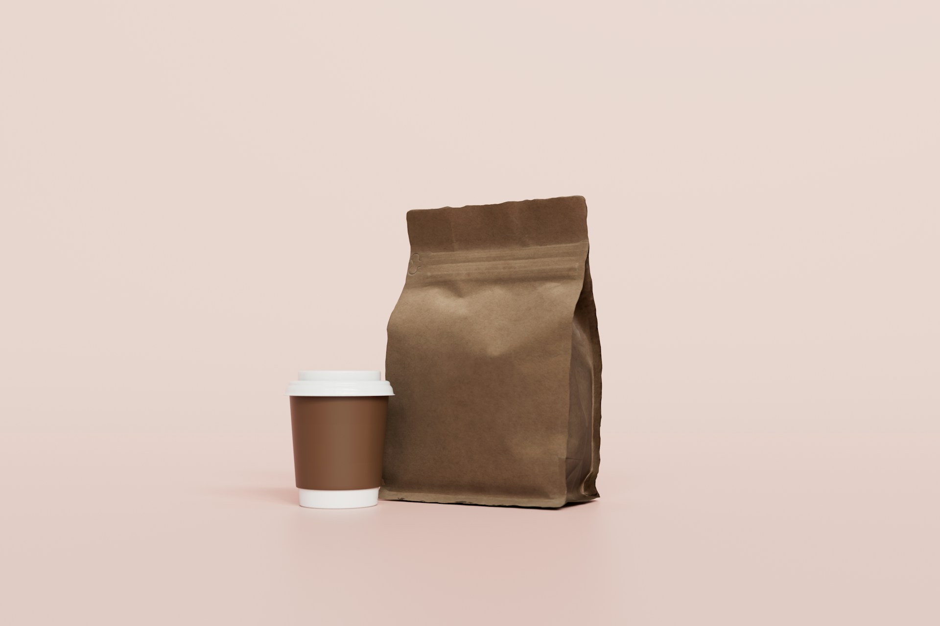 a coffee bag and a cup of coffee on a pink background
