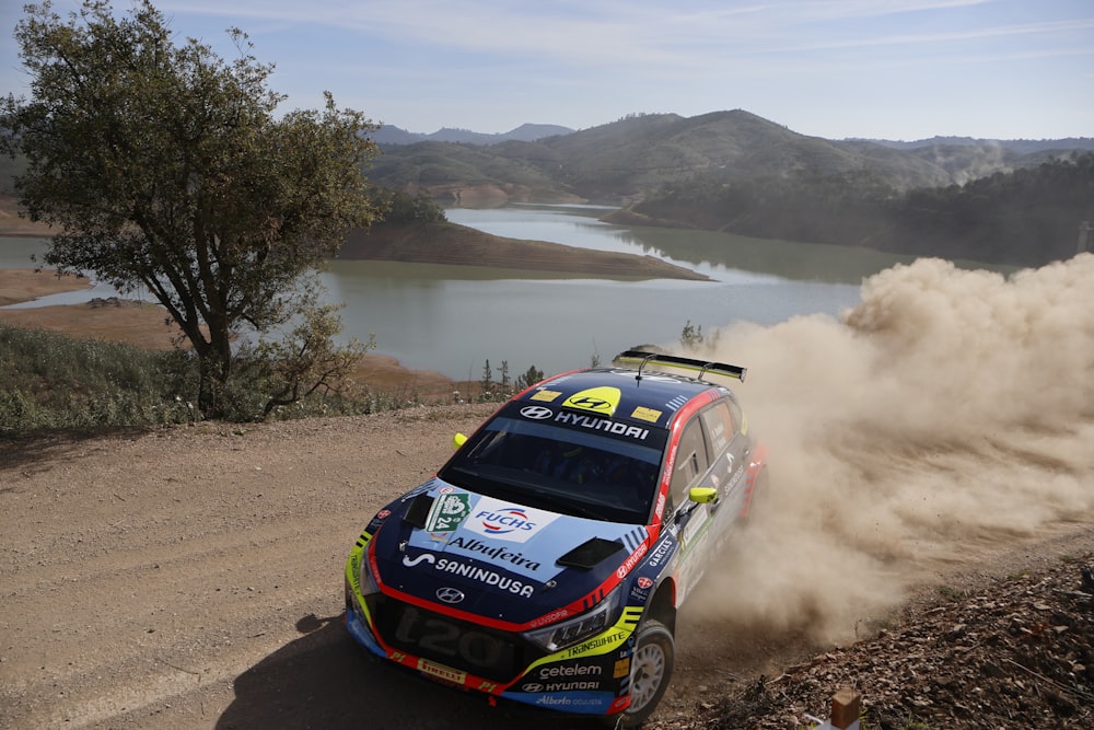 a rally car driving down a dirt road